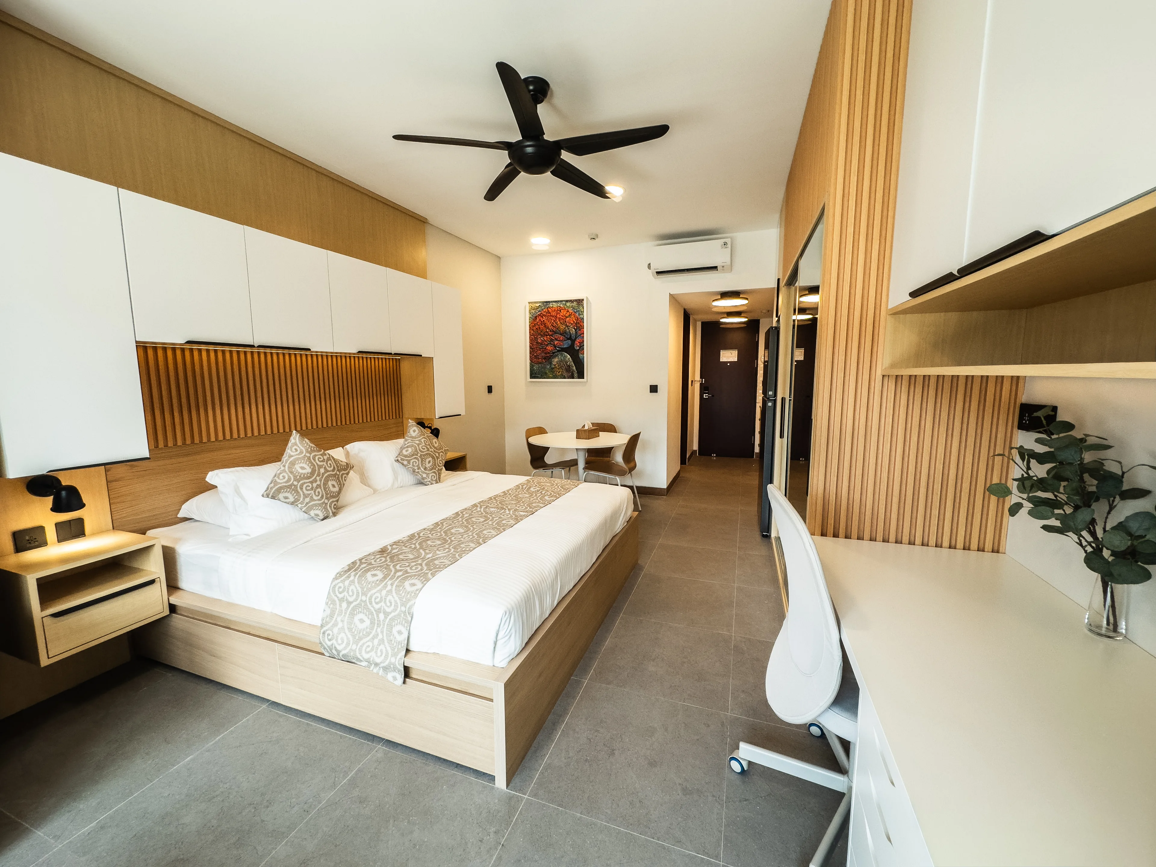 Interior of a de Lagoon residence looking toward the entry, with ceiling fan and air conditioning