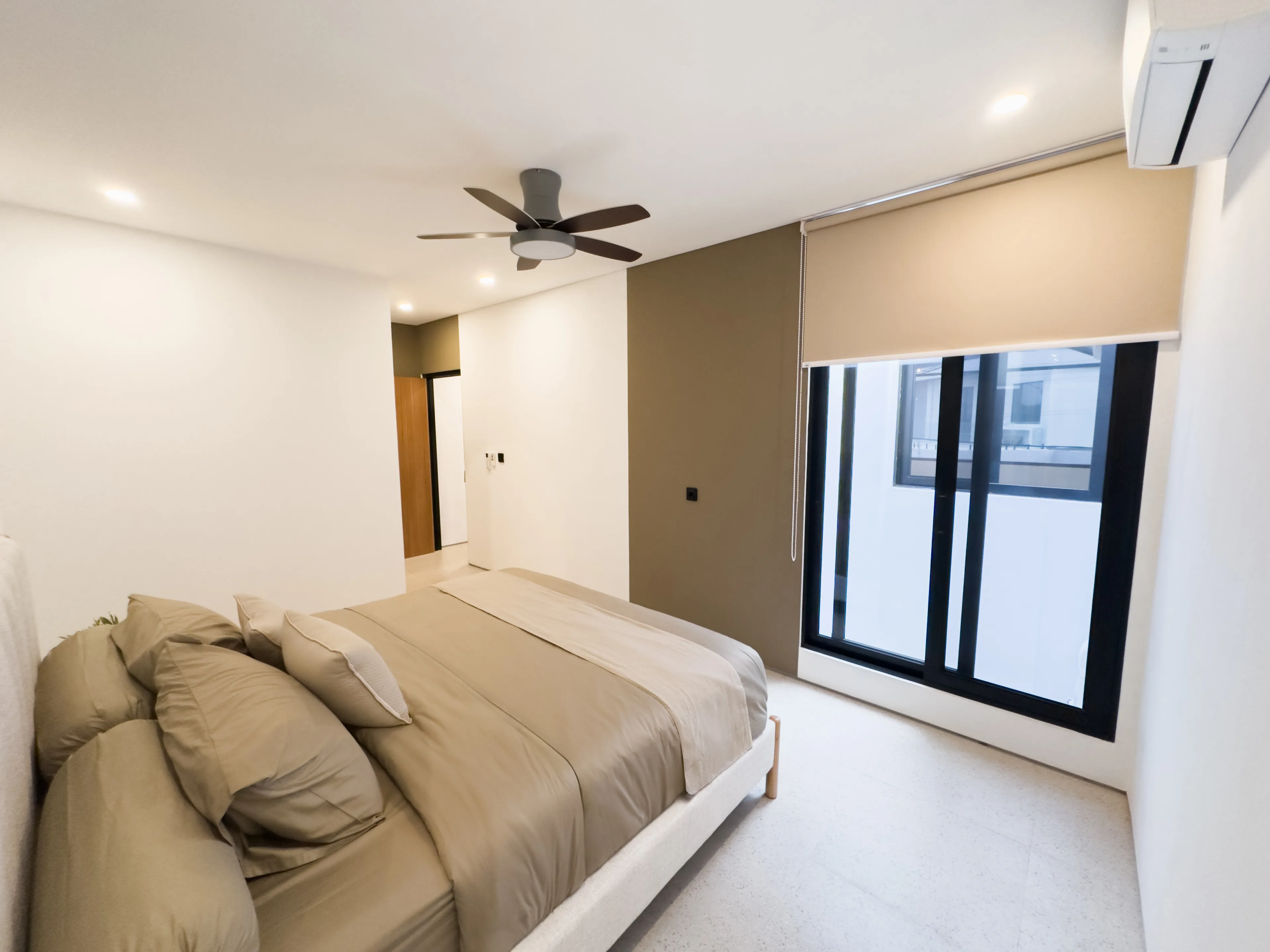 Completed bedroom in a delivered Sanur Breeze villa, with ceiling fan and air conditioning